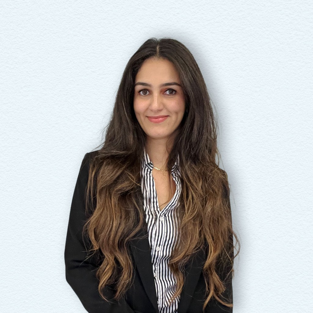 a woman with long hair wearing a black blazer