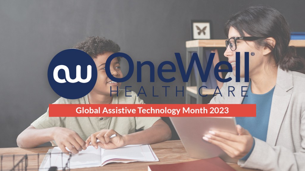 Assistive technology month 2023: two people sitting at a table with a book